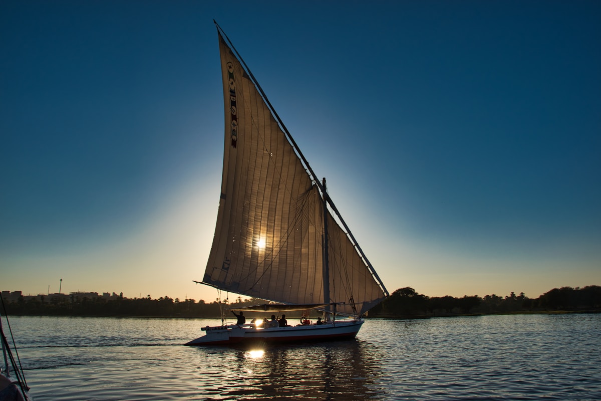 Felucca sailboats on the Nile at Aswan with Elephantine Island in the background
