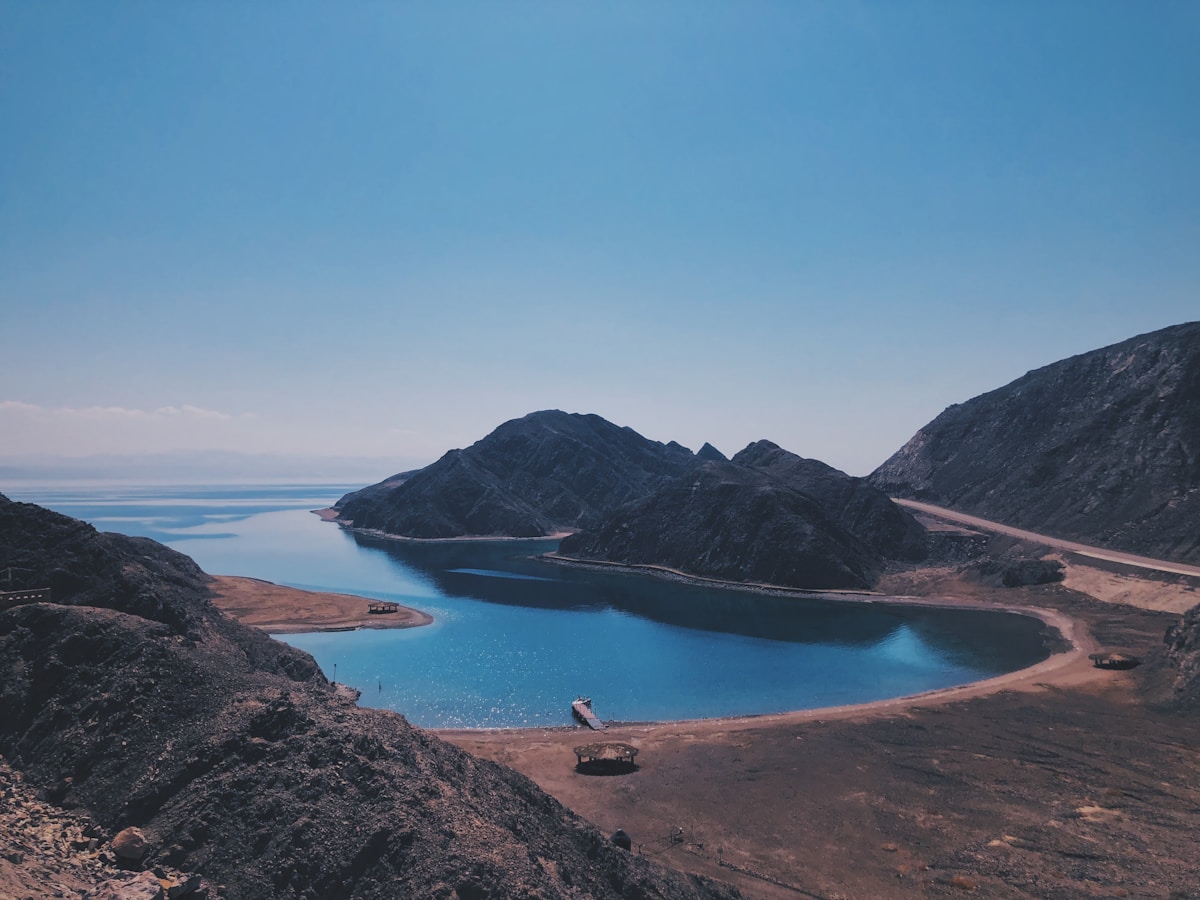 Dahab lagoon with wind surfers on the Gulf of Aqaba and Sinai mountains in the background