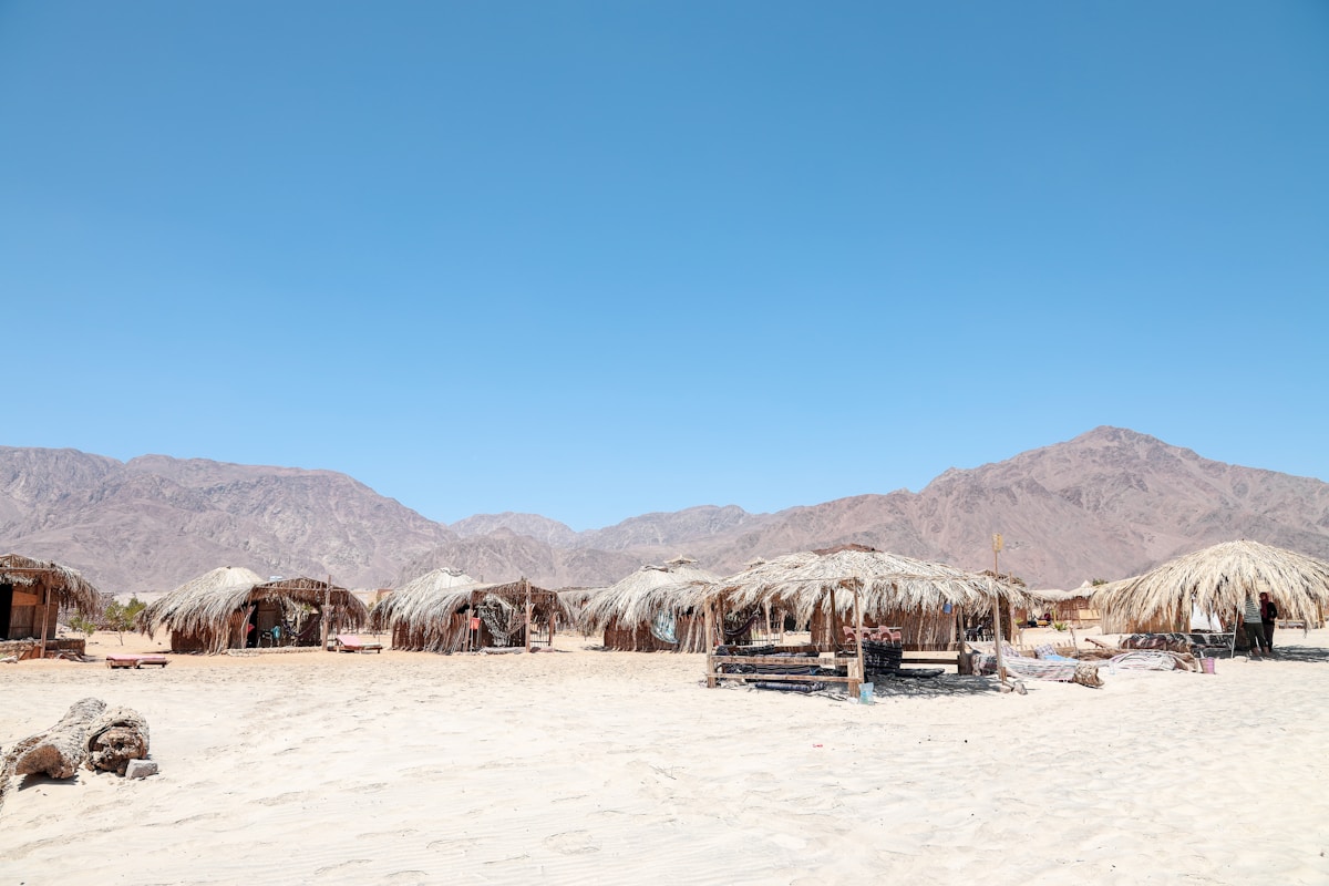 Open-air guesthouses and cafes along the lagoon strip in Dahab, Egypt