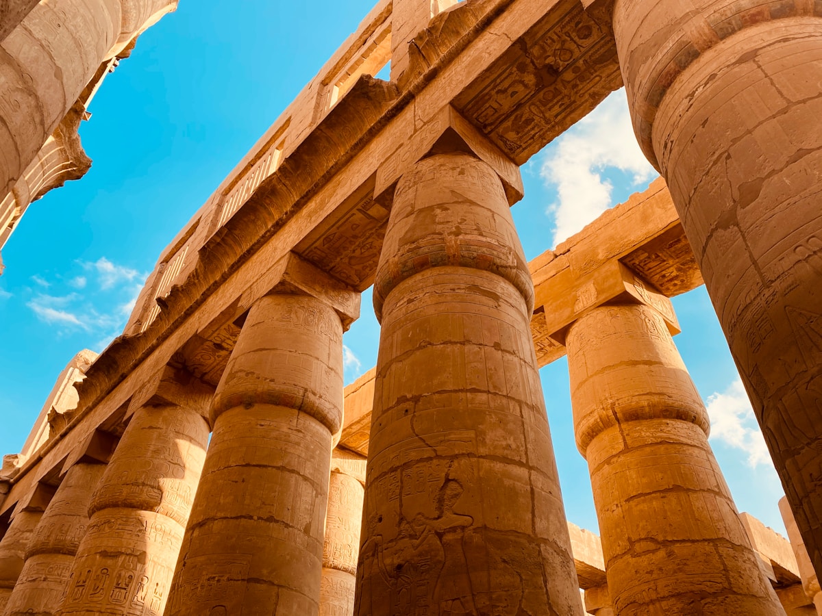 Karnak Temple hypostyle hall with towering carved columns at golden hour